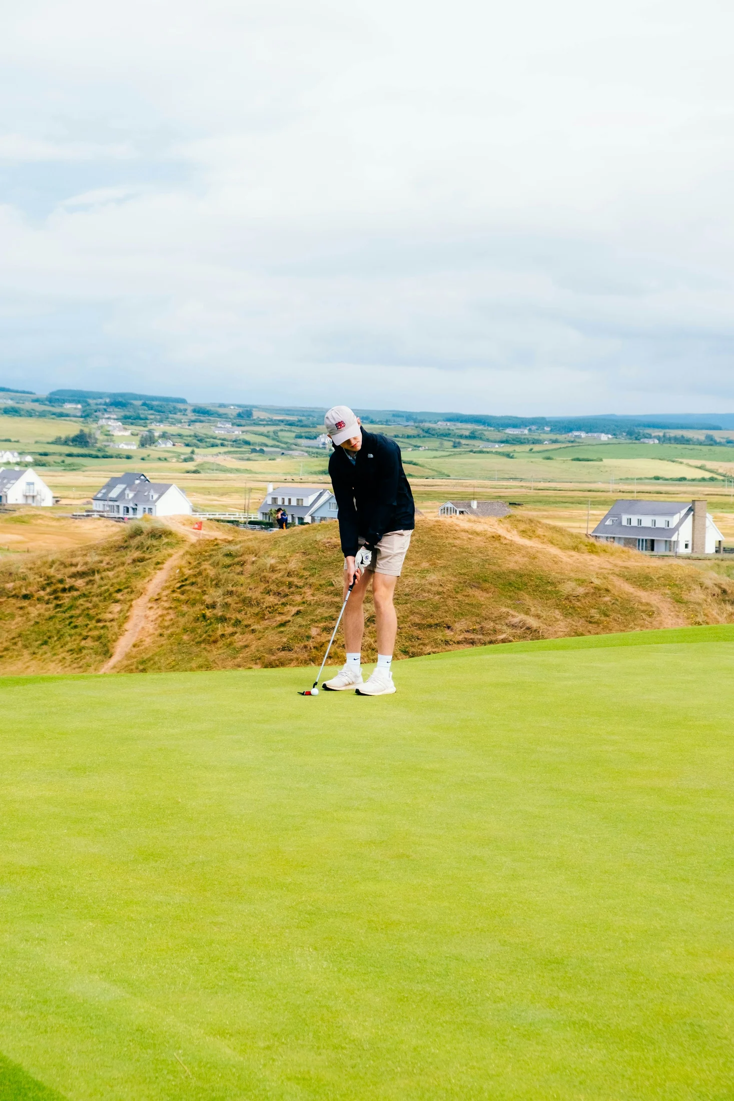 A golfer playing a links course at Lahinch in Ireland